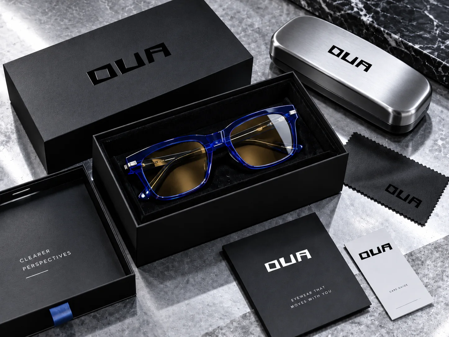 Ova packaging: black box with cobalt glasses, steel case, cloth and booklets
